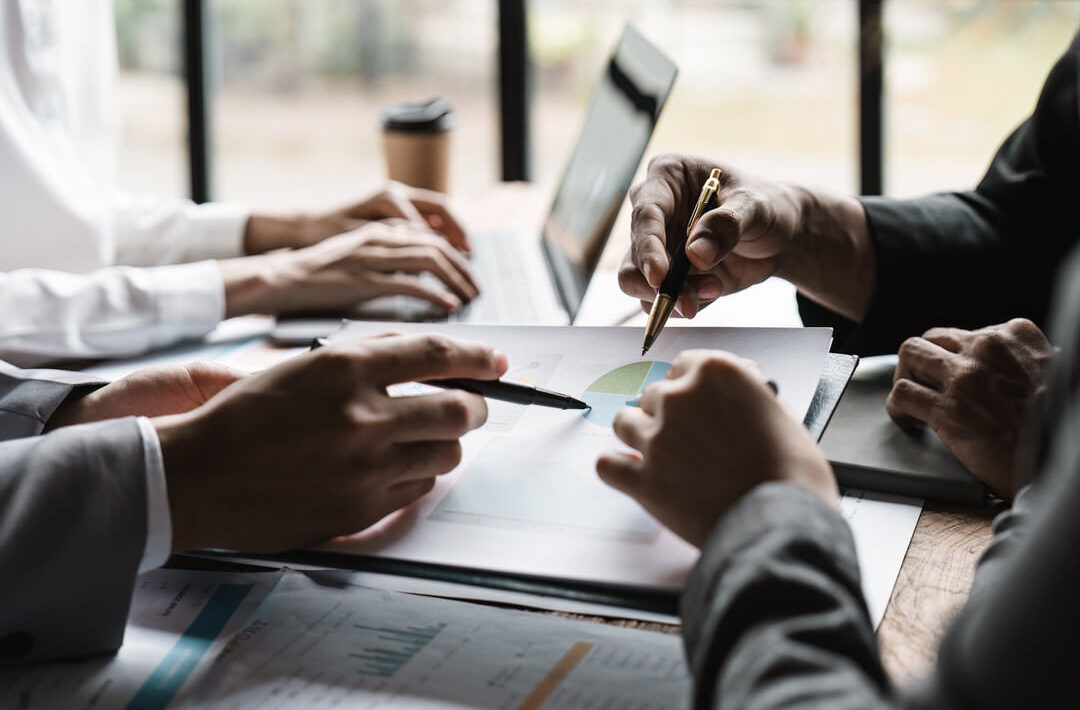 Startup business meeting to analyze and discuss the situation on the financial report in the meeting room. Investment Consultant, Financial advisor and accounting concept